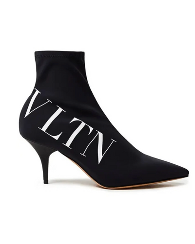 Black high-heeled ankle boots with 'VLTN' branding on a white background